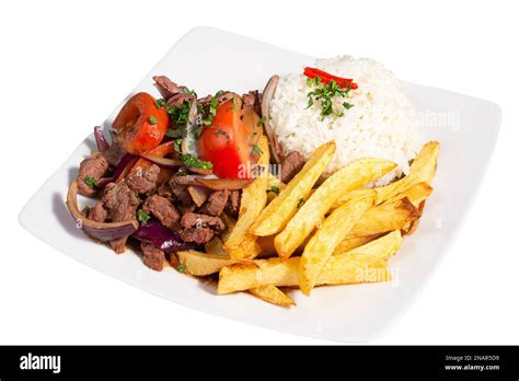 Peruvian Traditional Food A Beef With Tomatoes Onion Rice And Fried