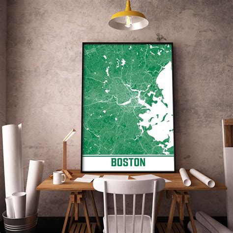 A Map Of Boston Is Displayed On A Wall Above A Table With Chairs And Lamps