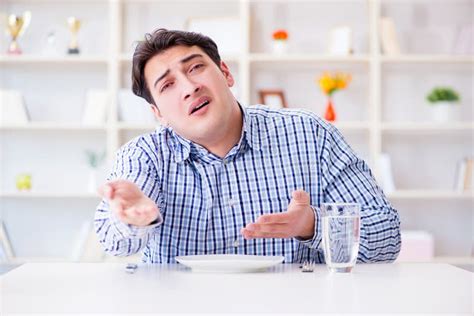 Man on Diet Waiting for Food in Restaurant Stock Photo - Image of drink, glass: 194349986