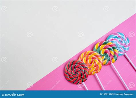 Set Of Colorful Spiral Lollipops On Colored Paper Stock Image Image