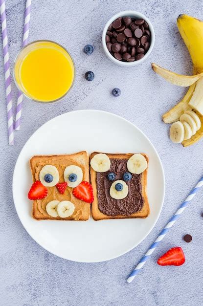 Premium Photo | Healthy funny face sandwiches for kids. animal faces toast