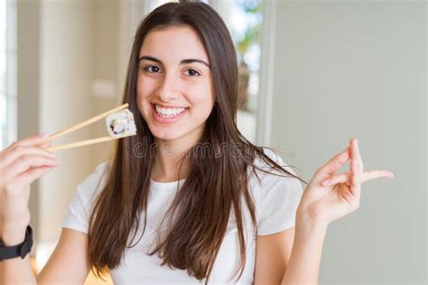 Beautiful Young Woman Eating Asian Sushi Using Chopsticks Very Happy