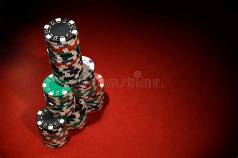 Top View Closeup of Poker Chips Stacked on Top of Each Other on a Red ...