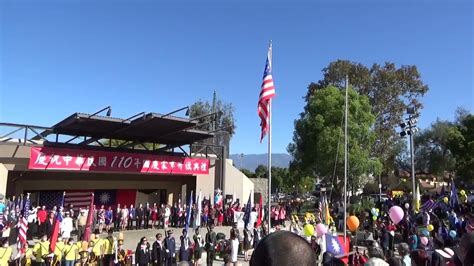 Us Flag Raising Ceremony And National Anthem At The 110th National Day