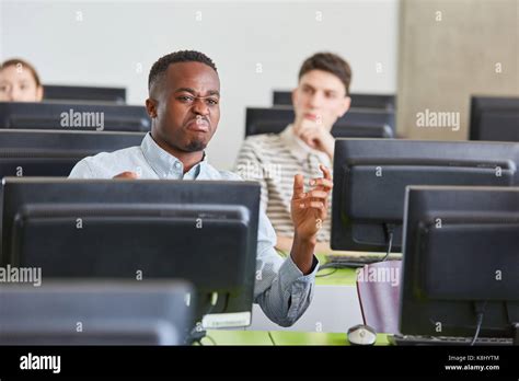 Angry man as african student in university class discussing in conflict Stock Photo - Alamy