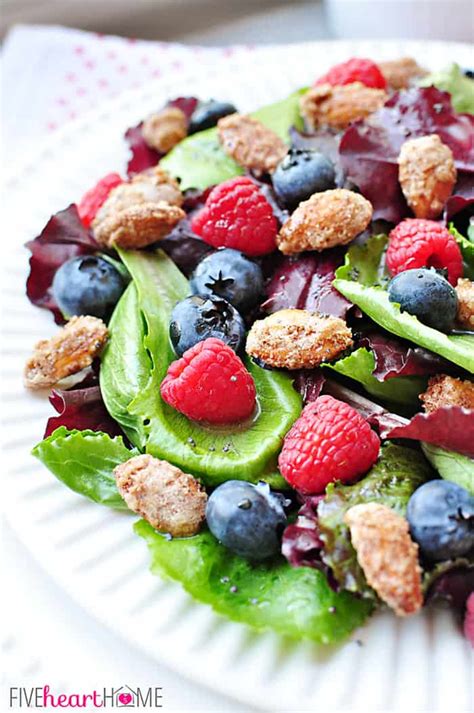 Spring Salad With Mixed Berries Candied Almonds And Honey Citrus