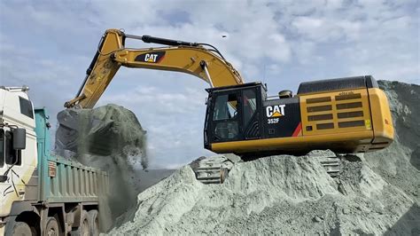 Caterpillar F And Caterpillar C Excavators Loading Man Trucks