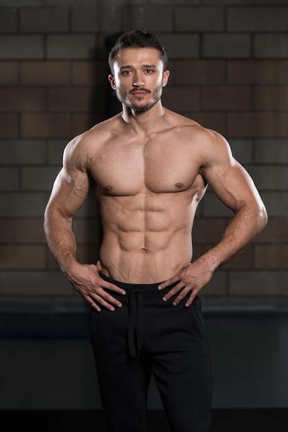 Premium Photo Portrait Of A Young Physically Fit Man Showing His Well