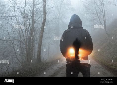 Hooded figure silhouette hi-res stock photography and images - Alamy