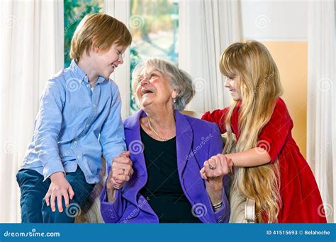 Grandchildren Visiting Their Elderly Grandmother Stock Photo - Image ...