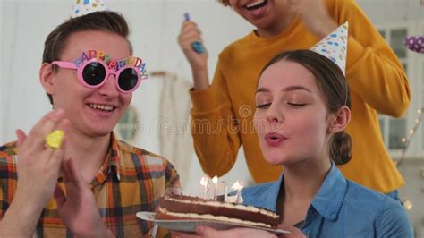 Make A Wish Woman Wearing Party Cap Blowing Out Burning Candles On Birthday Cake Happy