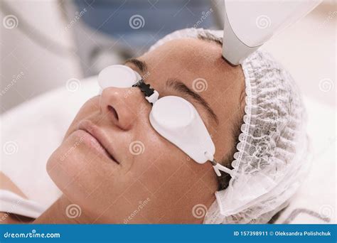 Woman Getting Laser Hair Removal Procedure By Beautician Stock Image