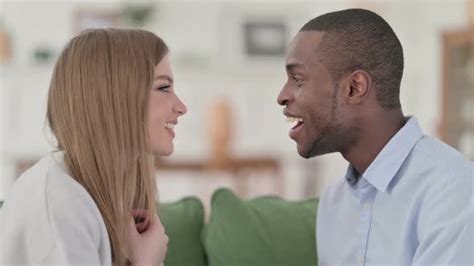 Loving Mixed Race Couple Having Conversation While Sitting On Sofa People Stock Footage Ft