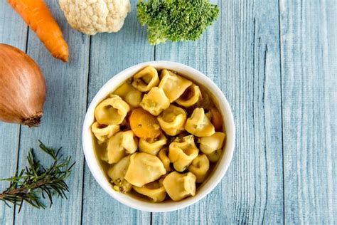 Premium Photo | Cappelletti soup and vegetables cappelletti italian ...