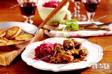 Wild Boar Goulash With Red Cabbage And Napkin Dumplings Stock Photo