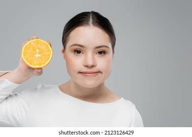 Young Woman Down Syndrome Holding Orange Stock Photo 2123126429 ...