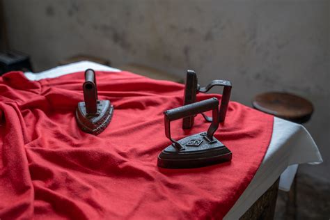 Black Clothes Iron on a Ironing Board · Free Stock Photo