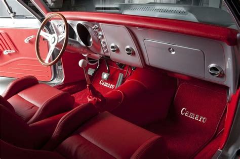 the interior of an old car with red leather seats and steering wheel ...