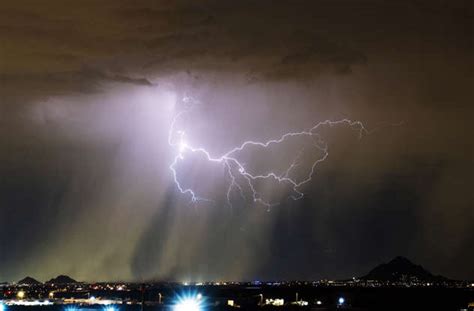 Lightning strikes over Arizona during monsoon thunderstorm