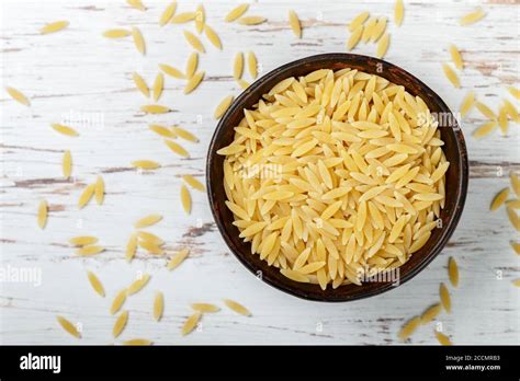 Orzo A Form Of Pasta Shaped Like Rice In A Ceramic Bowl Selective