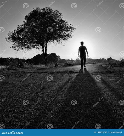 Silhouette of a Boy Walking Alone on the Lonely Road in Black and White Stock Image - Image of ...