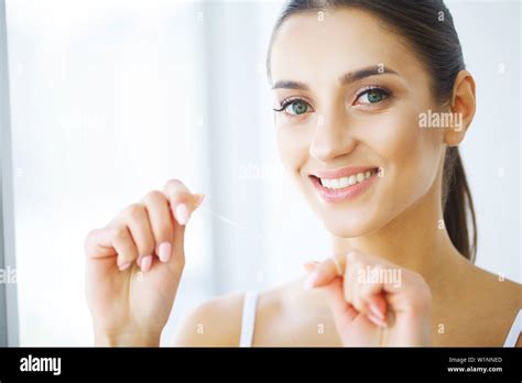 Teeth Care Beautiful Smiling Woman Flossing Healthy White Teeth High