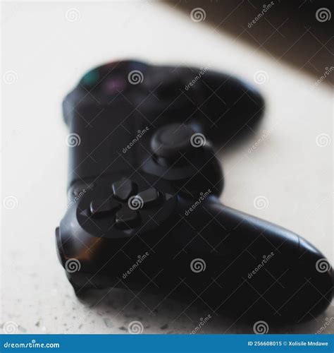 Black PS4 joystick stock image. Image of hand, camera - 256608015