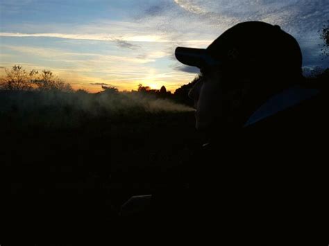 Premium Photo Silhouette Man Smoking Against Sky During Sunset