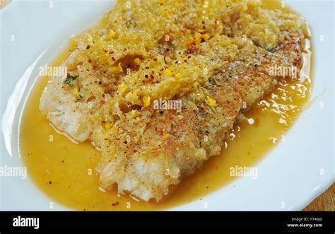 Grilled Monkfish In Orange Sauce Stock Photo Alamy