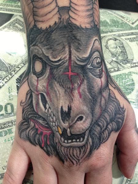 Evil decaying goat skull hand tattoo by Stevie Monie: TattooNOW