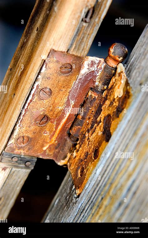 Rusty Hinge On Old Weathered Wood Taken At An Angle Stock Photo Alamy