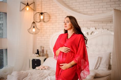 Premium Photo Beautiful Pregnant Woman Dressed In Elegant Red Negligee