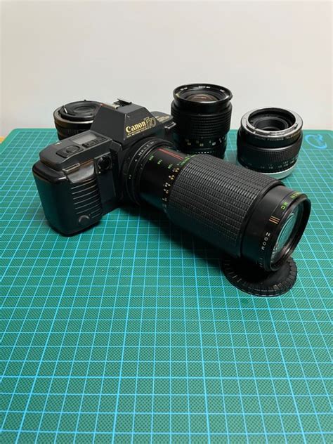 Canon T70 + 3 lenses + teleconvertor - Catawiki