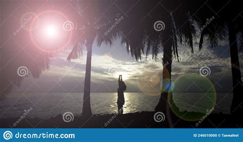 Silhouette Of Young Woman Standing Alone By The Sea Fitness On The