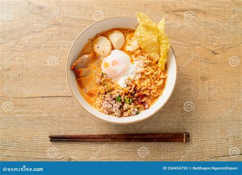 Instant Noodles With Pork And Meatballs In Spicy Soup Stock Image