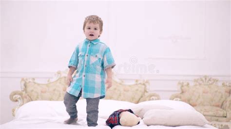 Funny Kids Jumping and Playing on Bed. Stock Video - Video of baby ...