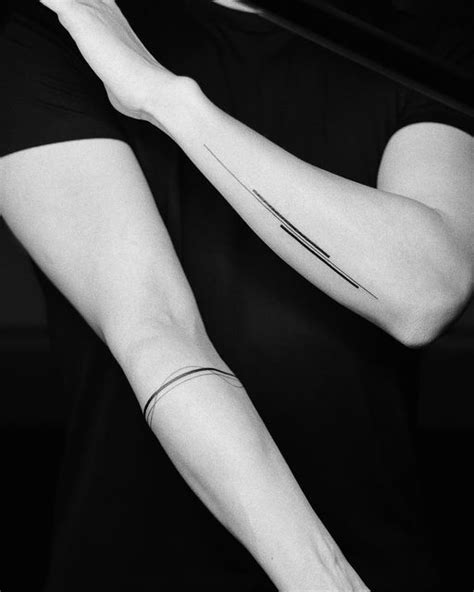 A Woman With A Tattoo On Her Arm