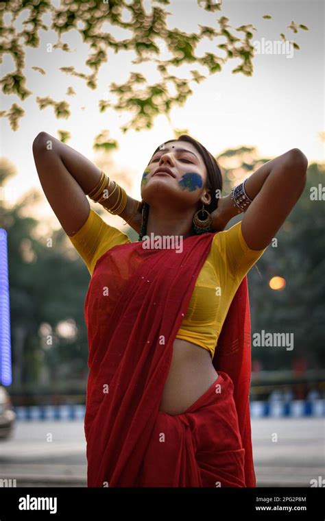 Portrait Of A Pretty Young Indian Woman Wearing Traditional Saree And