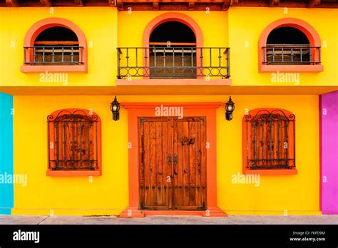 Exterior of Mexican house with wooden door and windows, Puerto Vallarta, Mexico Stock Photo - Alamy