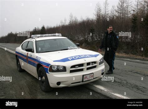 Royal Newfoundland Constabulary police officer and car Stock Photo - Alamy