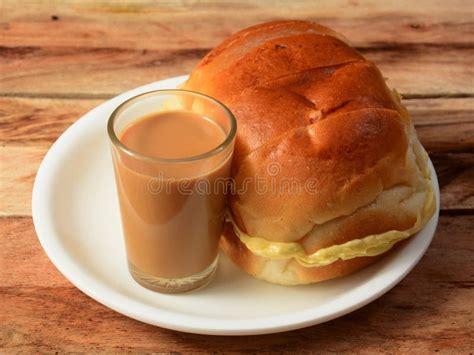 Indian Masala Chai With Bun Maska Bread On White Plate Selective Focus