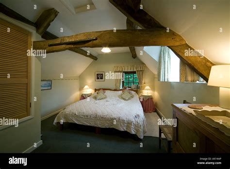 Country cottage bedroom Stock Photo - Alamy