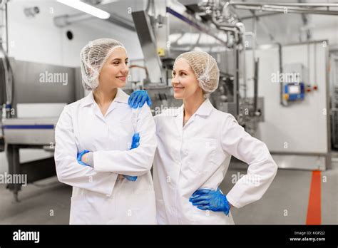 Happy Women Technologists At Ice Cream Factory Stock Photo Alamy