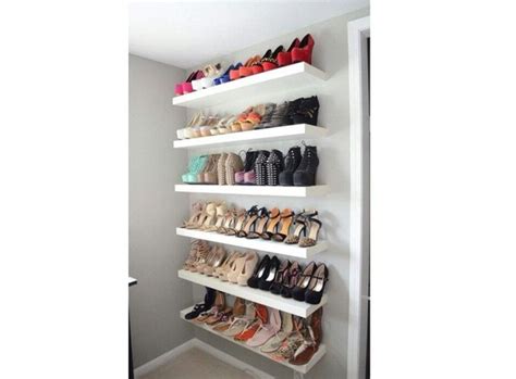 A White Shelf Filled With Lots Of Pairs Of Shoes