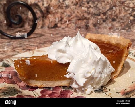 Pumpkin pie slice Stock Photo - Alamy