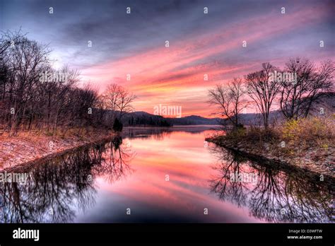 A Beautiful Sunrise Over A Lake Stock Photo Alamy