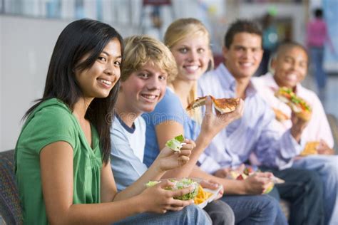 Teenagers Enjoying Lunch Together Stock Photo Image Of Horizontal