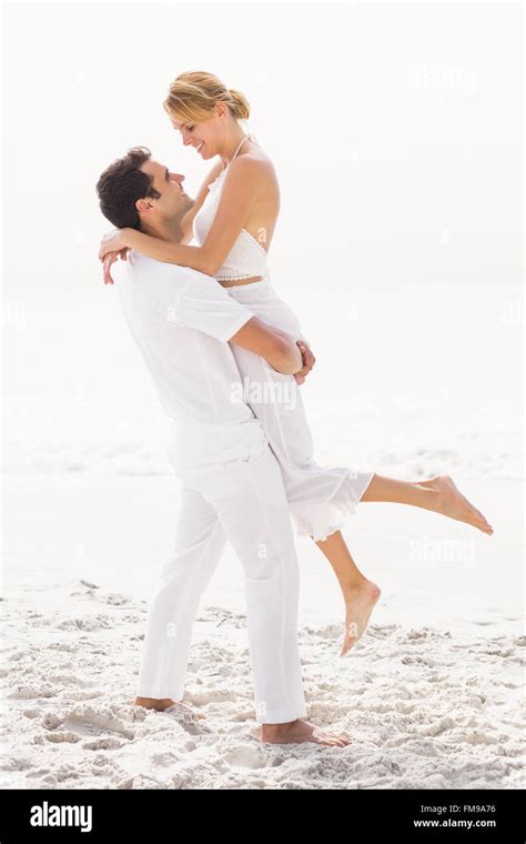 Man lifting woman hi-res stock photography and images - Alamy