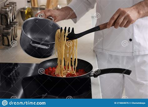 Professional Chef Cooking Delicious Pasta on Stove in Kitchen, Closeup ...