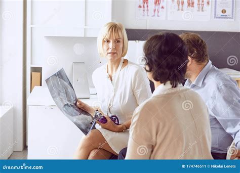 Couple At Reception Discussing Issues With A Sexologist Stock Image